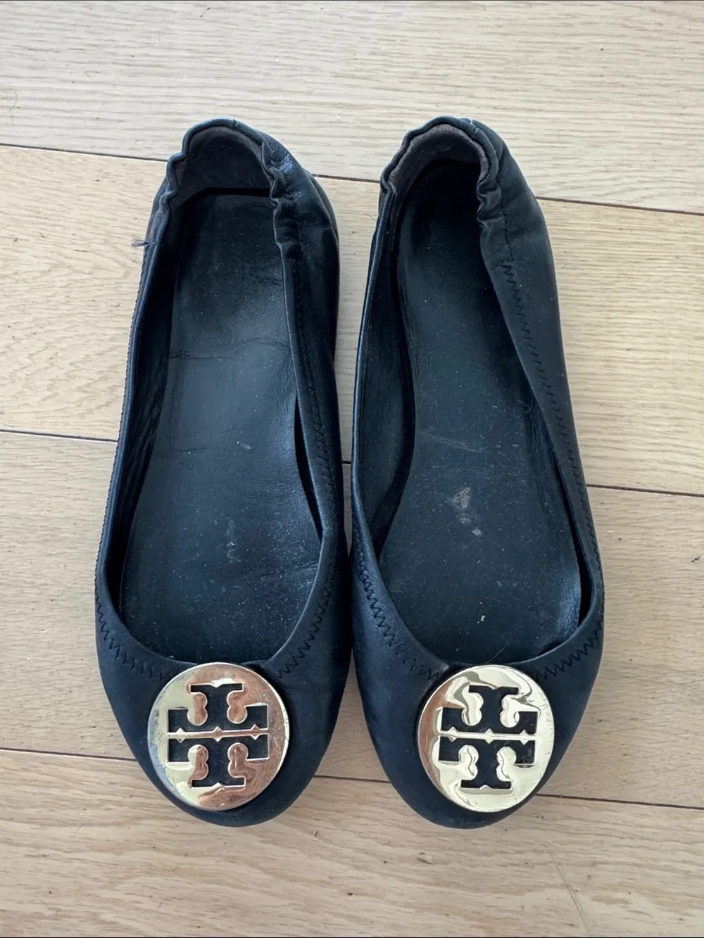 Tory Burch Black Ballet Flats with Gold Logo Medallions